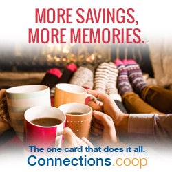 MORE SAVINGS, MORE MEMORIES. The one card that does it all. Connections.coop - Four people on a sofa enjoying cups of warm beverages in front of a toasty fireplace.