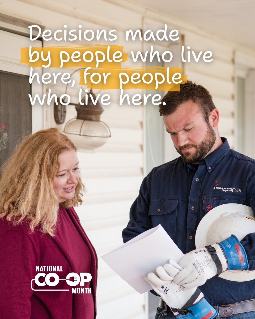 Decisions made by people who live here, for people who live here. Co-op employee discussing paperwork with member.