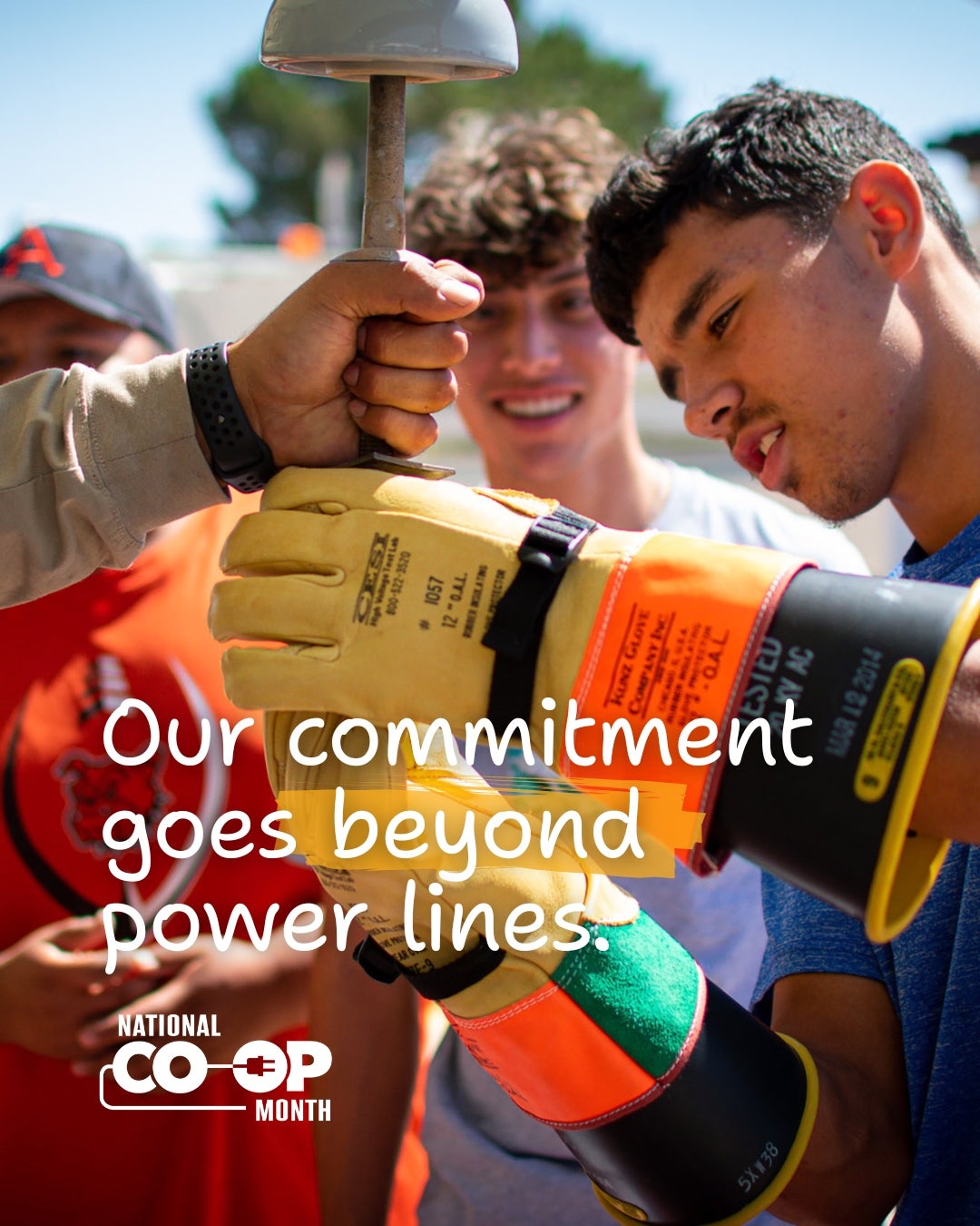 Our commitment goes beyond power lines. Co-op employee demonstrating equipment to students.