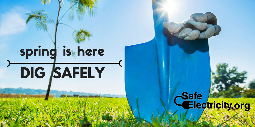 Spring is here. Dig Safely. A spade stuck into the ground.