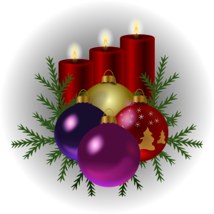 A holiday arrangement of four ornaments, three candles, and some evergreen branches