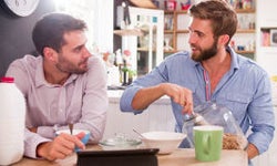 Two men eating breakfast