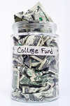 Glass jar labeled College Fund filled with money